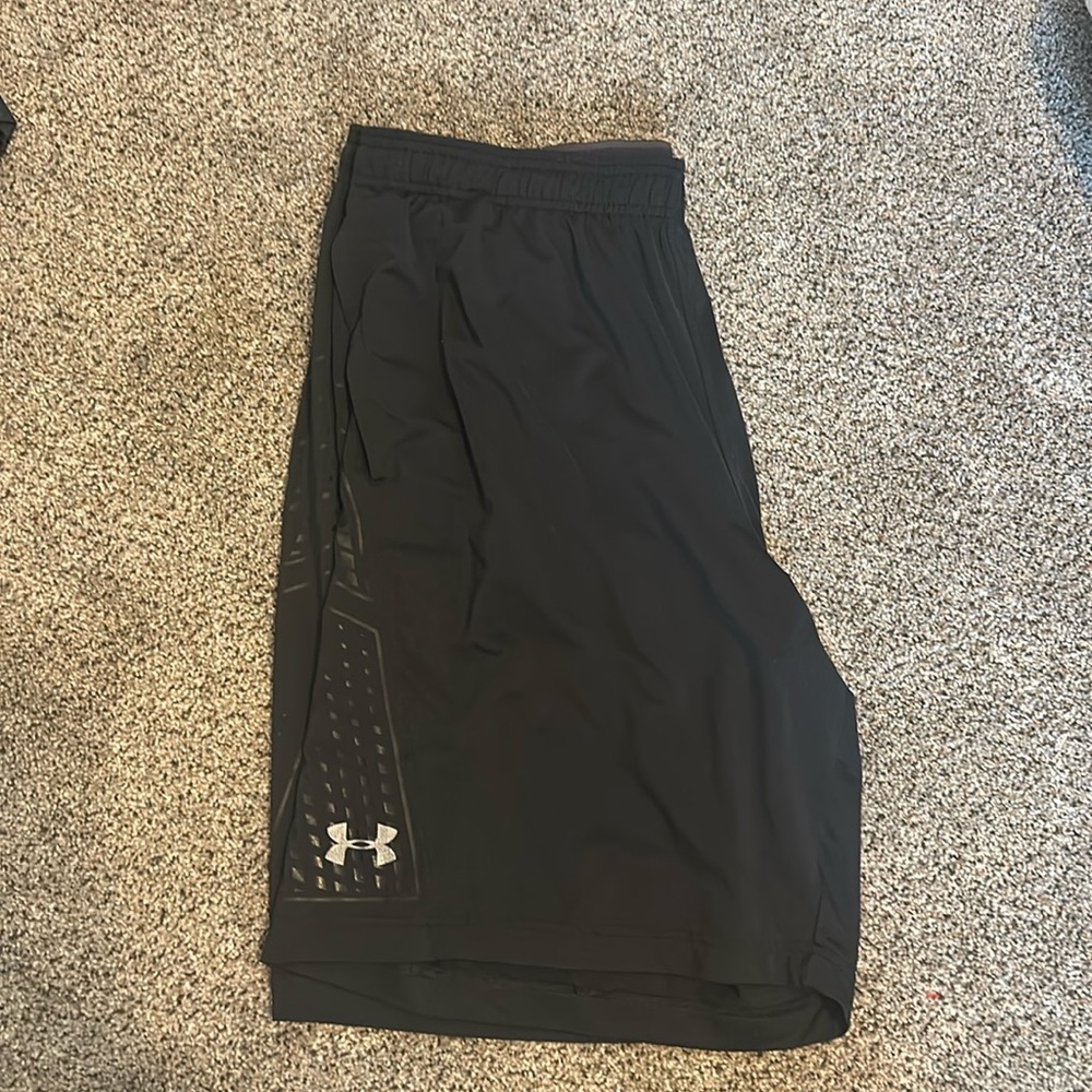 Two pairs of Under Armour athletic shorts (black and gray)